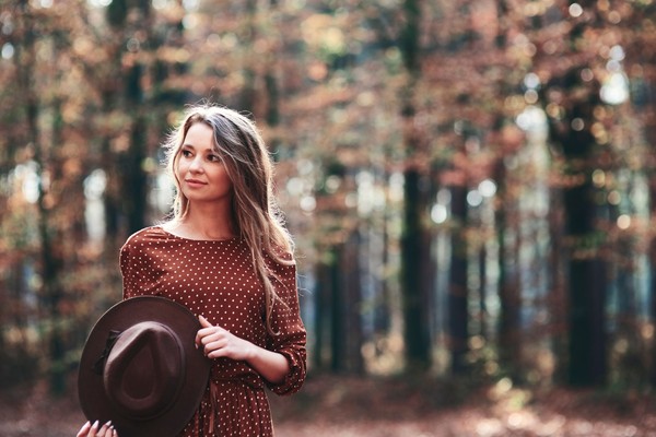 woman-walking-autumnal-forest